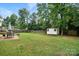 Well-maintained backyard featuring a large shed and spacious grassy area at 8381 Chatsworth Dr, Indian Land, SC 29707