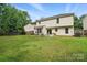 Spacious backyard features a patio area with outdoor seating and a fire pit at 8381 Chatsworth Dr, Indian Land, SC 29707