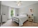 Inviting bedroom with a full sized bed, neutral walls, and large window at 8381 Chatsworth Dr, Indian Land, SC 29707