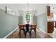 Charming dining room features wood table, stylish chairs, modern lighting, and serene ambiance at 8381 Chatsworth Dr, Indian Land, SC 29707