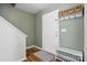 Neat entryway with convenient storage hooks, a bench, and stylish decor for an organized arrival at 8381 Chatsworth Dr, Indian Land, SC 29707