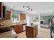Updated kitchen with stainless steel appliances, granite counters, and tile flooring at 8381 Chatsworth Dr, Indian Land, SC 29707