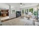 Bright living room featuring neutral decor, many windows, and hardwood flooring at 8381 Chatsworth Dr, Indian Land, SC 29707