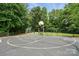 Community playground with basketball court, swings, climbing equipment, and seating at 8381 Chatsworth Dr, Indian Land, SC 29707