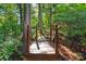 Wooden bridge with railings surrounded by natural landscaping at 8744 Barrister Way, Charlotte, NC 28216