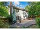 Backyard with paver patio, stone landscaping, and outdoor seating at 8744 Barrister Way, Charlotte, NC 28216