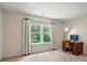 Bedroom with a large window offering plenty of natural light and a quaint desk at 8744 Barrister Way, Charlotte, NC 28216