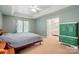 Spacious primary bedroom with tray ceilings and ensuite bath access, complemented by neutral décor at 8744 Barrister Way, Charlotte, NC 28216