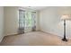Cozy bedroom with neutral walls, window providing natural light and plush carpeting at 8744 Barrister Way, Charlotte, NC 28216
