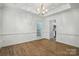 Light and airy dining room featuring wood floors and decorative lighting at 8744 Barrister Way, Charlotte, NC 28216