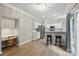 Bright kitchen with stainless steel appliances, bar seating, and wood-look flooring at 8744 Barrister Way, Charlotte, NC 28216