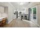 Bright kitchen with stainless steel appliances, bar seating, and wood-look flooring at 8744 Barrister Way, Charlotte, NC 28216