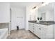 Bathroom with double sink vanity and granite countertops at 8916 Inverness Bay Rd, Charlotte, NC 28278