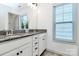 Elegant bathroom vanity with granite countertops, dual sinks, and stylish fixtures at 8916 Inverness Bay Rd, Charlotte, NC 28278