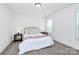 Inviting bedroom with a comfortable bed, side tables, and soft lighting at 8916 Inverness Bay Rd, Charlotte, NC 28278