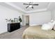 Bright bedroom featuring neutral walls, decor, and carpet flooring, and a tray ceiling at 8916 Inverness Bay Rd, Charlotte, NC 28278