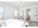 Comfortable bedroom with a full bed, shelving, and bright natural light at 8916 Inverness Bay Rd, Charlotte, NC 28278