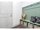 Cozy entryway featuring storage bench with built-ins, decorative pillows, and baskets at 8916 Inverness Bay Rd, Charlotte, NC 28278