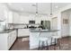 Bright kitchen featuring granite countertops, stainless steel appliances, a breakfast bar, and modern pendant lighting at 8916 Inverness Bay Rd, Charlotte, NC 28278
