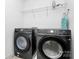 Laundry room featuring modern washer and dryer units at 8916 Inverness Bay Rd, Charlotte, NC 28278