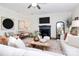 Stylish living room featuring a fireplace, comfortable seating, and elegant decor at 8916 Inverness Bay Rd, Charlotte, NC 28278