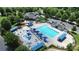 Beautiful community pool featuring a splash pad, lounge chairs, and shaded picnic tables at 8916 Inverness Bay Rd, Charlotte, NC 28278