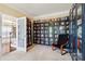 This library features built-in shelving and a black chair at 9034 Kensington Forest Dr, Harrisburg, NC 28075