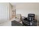 Cozy living room featuring plush recliners and a dark ottoman at 9034 Kensington Forest Dr, Harrisburg, NC 28075