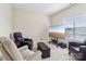 Cozy living room setup with a large television and comfortable seating arrangement at 9034 Kensington Forest Dr, Harrisburg, NC 28075