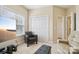 Bright living room with a TV and comfortable seating near natural light at 9034 Kensington Forest Dr, Harrisburg, NC 28075