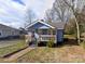 Charming one-story home featuring a cozy front porch and a classic blue exterior at 926 Cantwell St, Charlotte, NC 28208