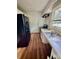 Functional kitchen with stainless steel sink and black appliances, adjacent to back entrance at 926 Cantwell St, Charlotte, NC 28208