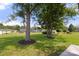 Large, lush backyard featuring mature shade trees and green grass for outdoor enjoyment at 1067 Winchester Dr, Rock Hill, SC 29730