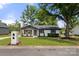 Quaint single-Gathering home featuring a lovely landscaped front yard, painted brick, and a brick mailbox at 1067 Winchester Dr, Rock Hill, SC 29730