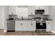 Modern kitchen with white cabinetry, stainless steel appliances, and granite countertops at 1067 Winchester Dr, Rock Hill, SC 29730