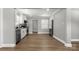Bright kitchen featuring white cabinets, gray stainless-steel appliances, and hardwood floors at 1067 Winchester Dr, Rock Hill, SC 29730