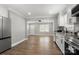 A renovated kitchen with granite counters, stainless steel appliances and hardwood flooring at 1067 Winchester Dr, Rock Hill, SC 29730