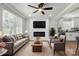 Open living room features a ceiling fan, fireplace, and modern furniture with great natural light at 1067 Winchester Dr, Rock Hill, SC 29730