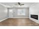 Inviting living space with wood flooring, an electric fireplace, and ample natural light at 1067 Winchester Dr, Rock Hill, SC 29730