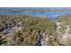 Breathtaking aerial view of the property nestled among lush greenery and overlooking a serene lake at 108 Sailors Ct # 108 B, Mount Gilead, NC 27306