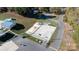 This aerial showcases the basketball court and playground area; fun for all ages at 108 Sailors Ct # 108 B, Mount Gilead, NC 27306