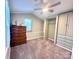 Spacious bedroom featuring a large closet, soft carpet, and a bright window for natural light, offering comfort at 108 Sailors Ct # 108 B, Mount Gilead, NC 27306