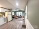 Inviting living room with natural light, ceiling fan, and comfortable seating, blending seamlessly with the kitchen area at 108 Sailors Ct # 108 B, Mount Gilead, NC 27306