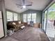 Open living space with plush carpet, vaulted ceilings, and sliding glass doors to a porch at 108 Sailors Ct # 108 B, Mount Gilead, NC 27306