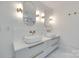 Bathroom featuring double vanity sinks, gold fixtures and contemporary mirrors at 1134 Blueberry Ln, Charlotte, NC 28226