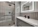 Modern bathroom boasts glass-enclosed shower, sleek vanity with illuminated mirror at 1134 Blueberry Ln, Charlotte, NC 28226