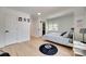 Light filled bedroom with hardwood floors, white walls, and accent lighting at 1134 Blueberry Ln, Charlotte, NC 28226