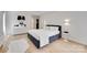 Modern bedroom featuring hardwood floors, artwork, and recessed lighting at 1134 Blueberry Ln, Charlotte, NC 28226