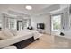 Bright bedroom featuring hardwood floors, recessed lights, windows and tray ceiling at 1134 Blueberry Ln, Charlotte, NC 28226