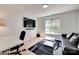 Bedroom featuring wood floors, a couch, tv, and natural light at 1134 Blueberry Ln, Charlotte, NC 28226